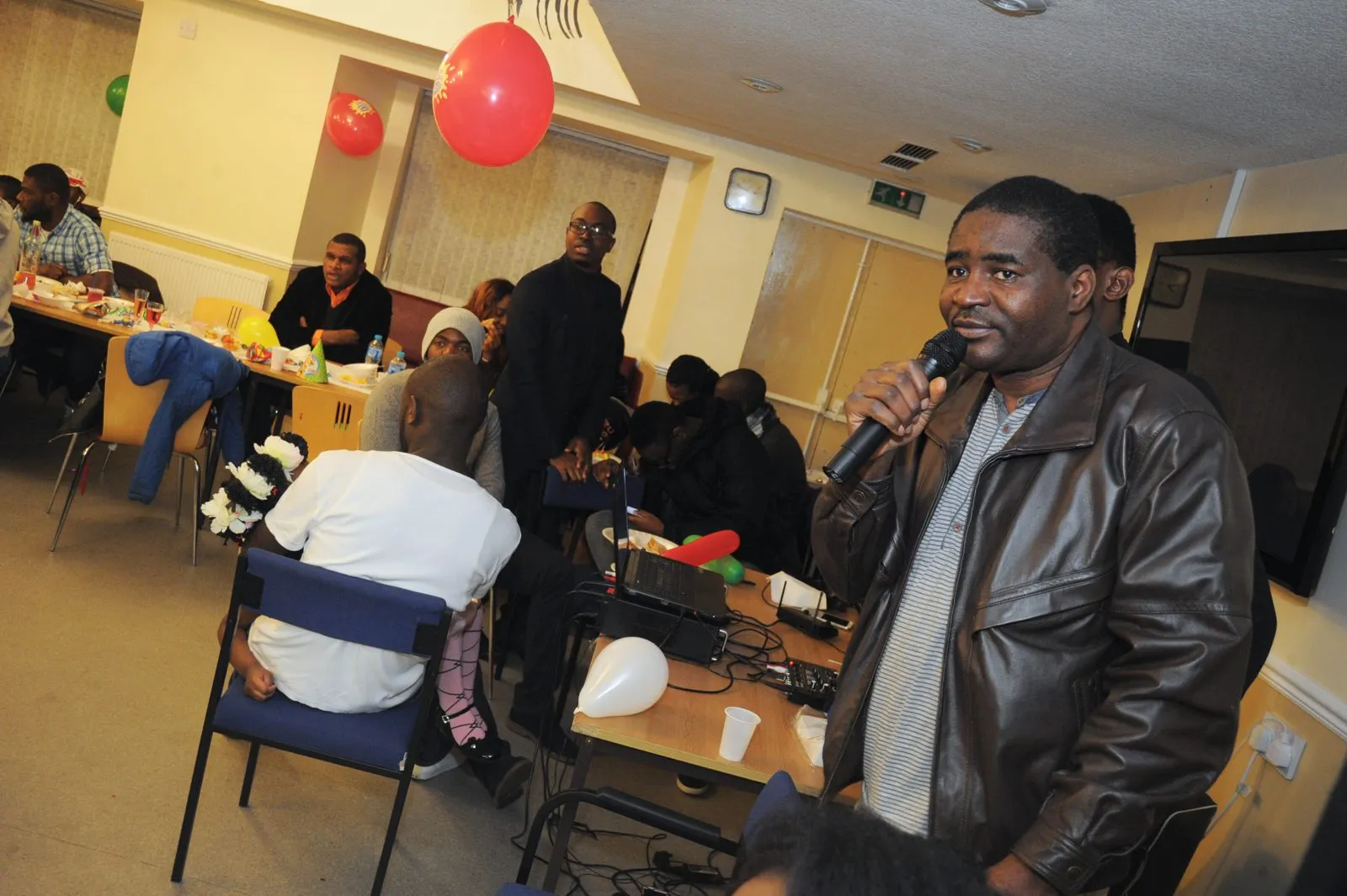 A speaker addressing guests at a MEG community event