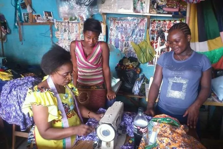 Women learning to sew together at a MEG sewing class